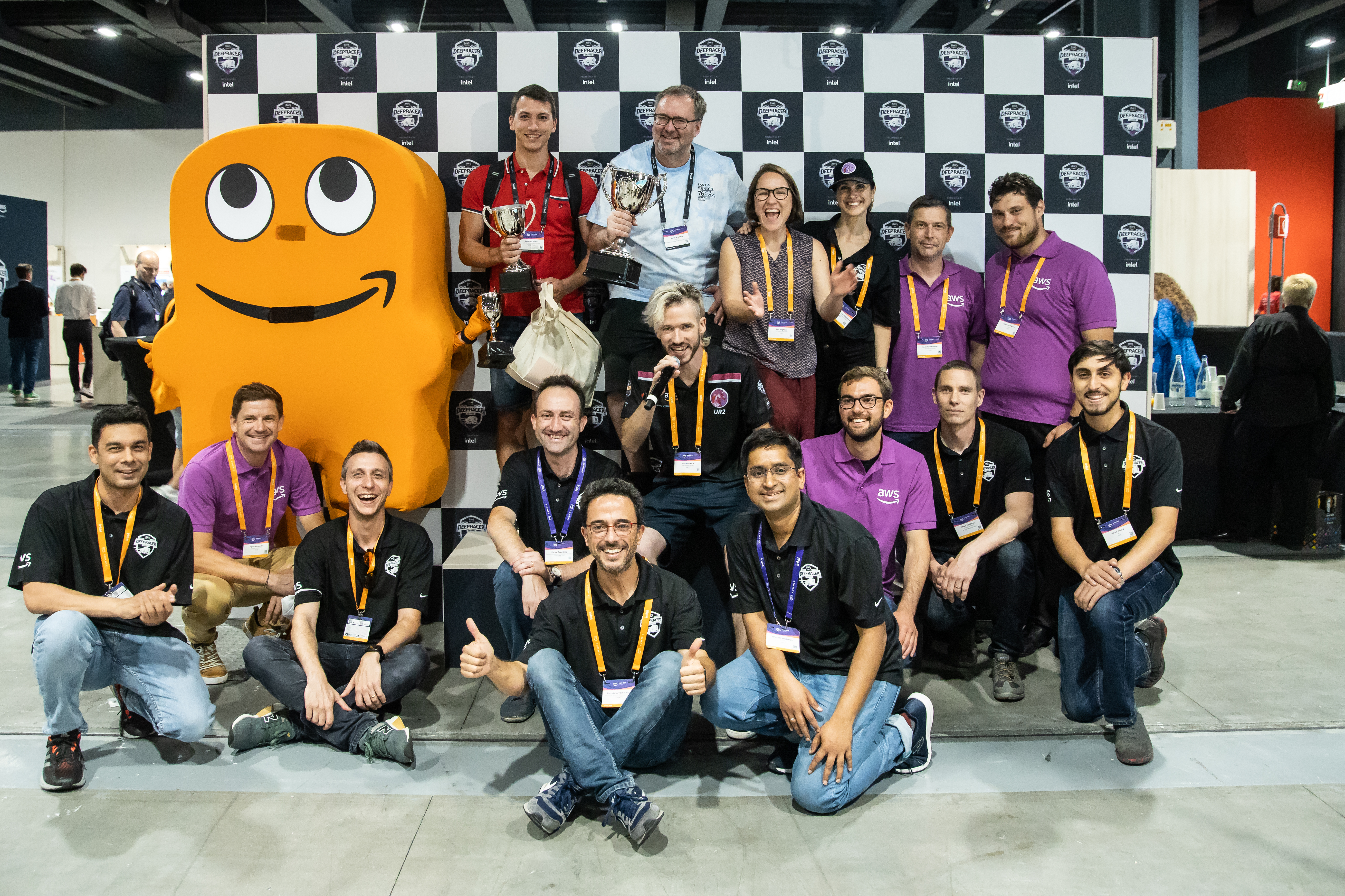 James in the blue T-shirt at the back, together with racers and the pit crew at AWS Summit Milan 2022 (Source: James Jennens)