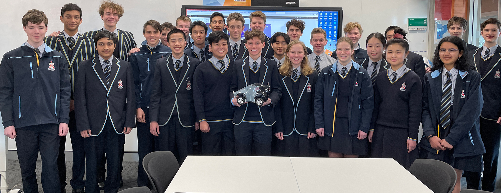 CGS Students participating in the IT course; student with DeepRacer is CGS-Huge-Hadr0n who finished seventh. Photo courtesy of Matthew Purcell