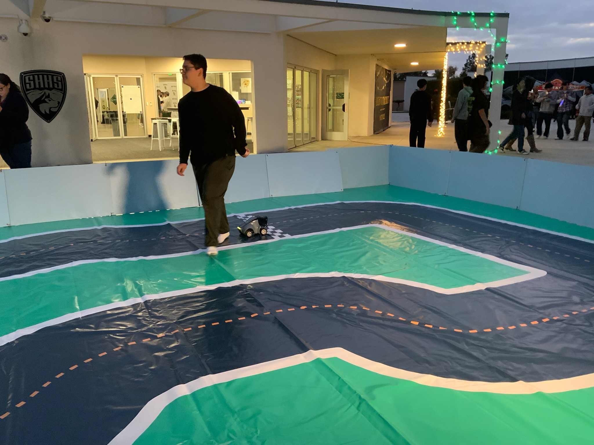 Armando runs beside the DeepRacer Agent!