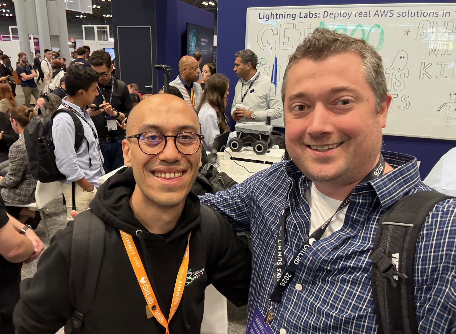 The author with Cagatay Cali at the robotics booth on the AWS Summit expo floor