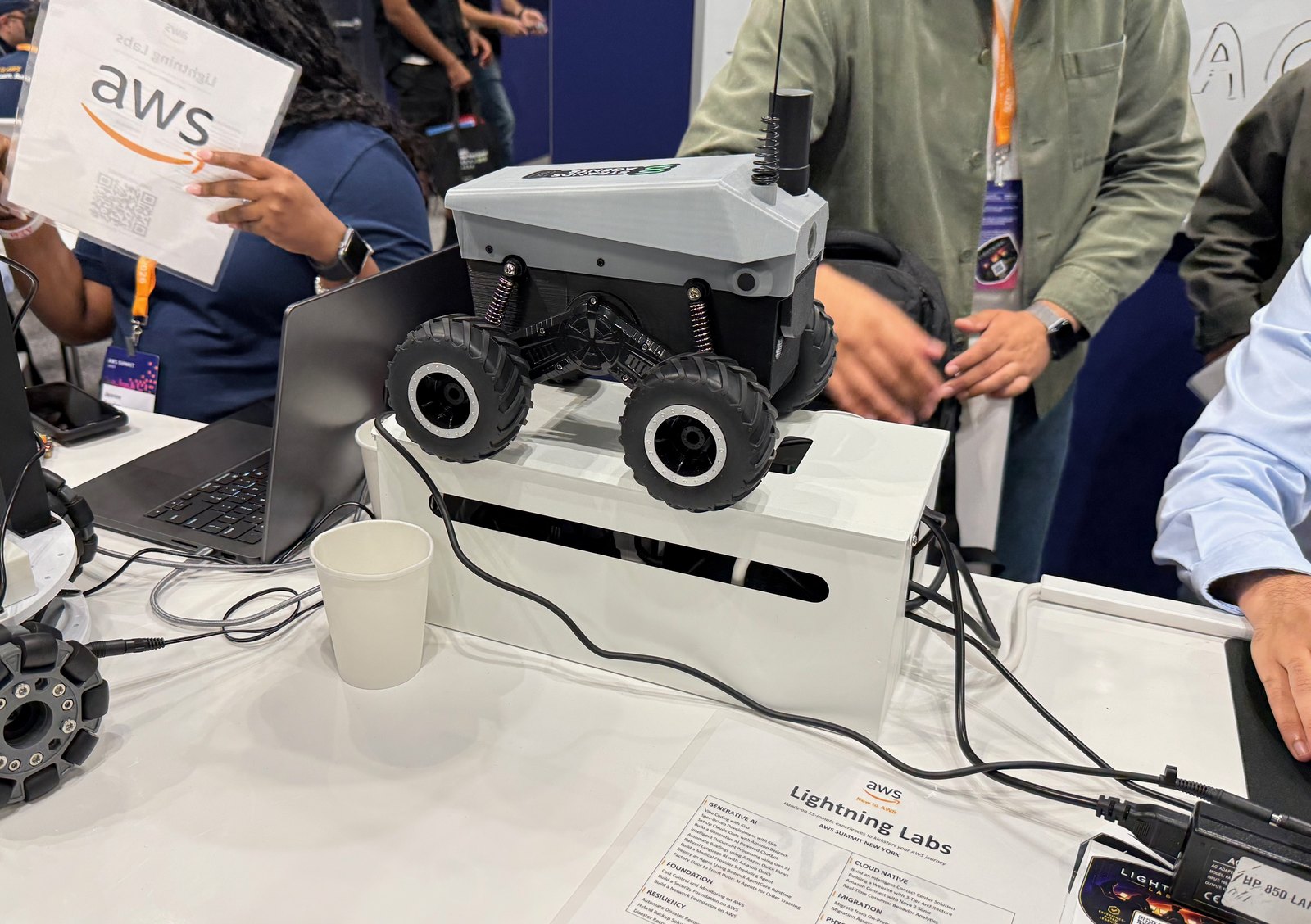 Close up of a small four wheeled camera equipped rover on a demo table at the AWS Summit